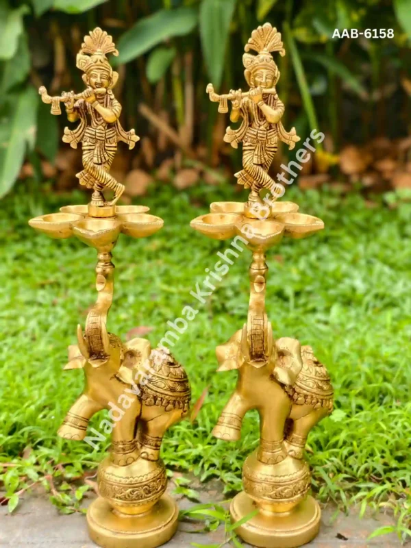 krishna standing on top of elephant decor lamp